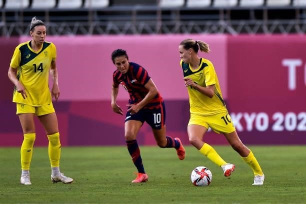 Carli Lloyd of the United States fight for possession with Emily van Egmond of Australia during the Tokyo 2020 Olympic Womens Football Tournament...