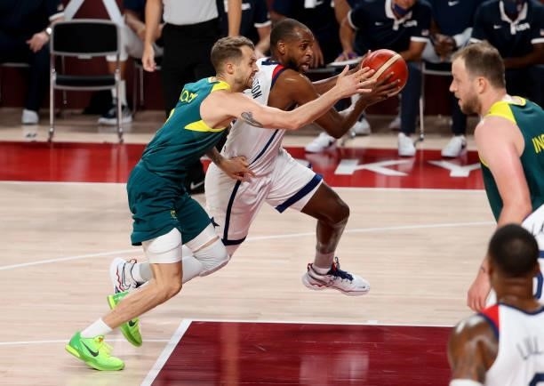 Nathan Sobey of Australia, Khris Middleton of USA during the Men's Semifinal Basketball game between United States and Australia on day thirteen of...