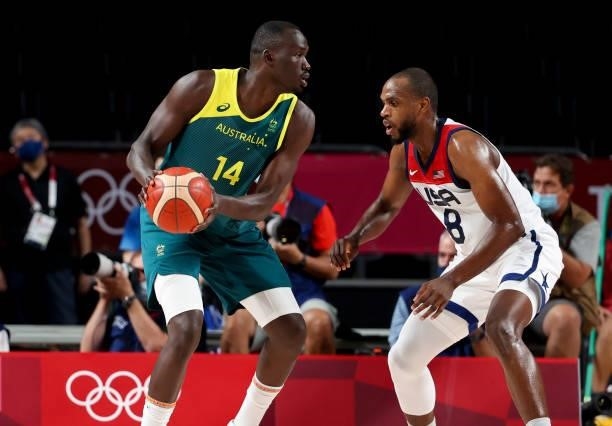 Duop Thomas Reath of Australia, Khris Middleton of USA during the Men's Semifinal Basketball game between United States and Australia on day thirteen...