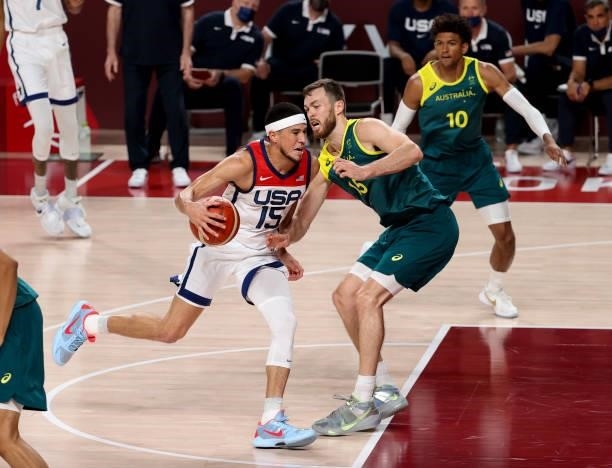 Devin Booker of USA, Nic Kay of Australia during the Men's Semifinal Basketball game between United States and Australia on day thirteen of the Tokyo...