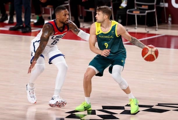 Nathan Sobey of Australia, Damian Lillard of USA during the Men's Semifinal Basketball game between United States and Australia on day thirteen of...