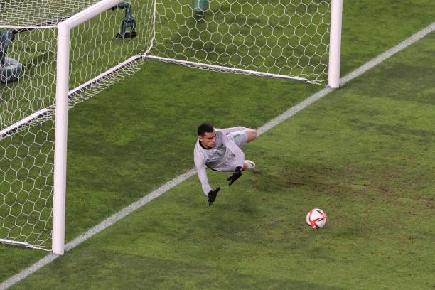 Santos of Team Brazil saves the first penalty from Eduardo Aguirre of Team Mexico during the penalty shoot out during the Men's Football Semi-final...