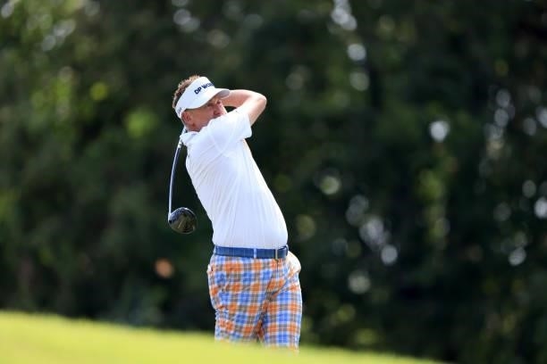 Ian Poulter of England plays a shot on the ninth hole during the first round of the World Golf Championship-FedEx St Jude Invitational at TPC...