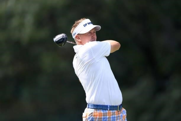 Ian Poulter of England plays a shot on the seventh hole during the first round of the World Golf Championship-FedEx St Jude Invitational at TPC...