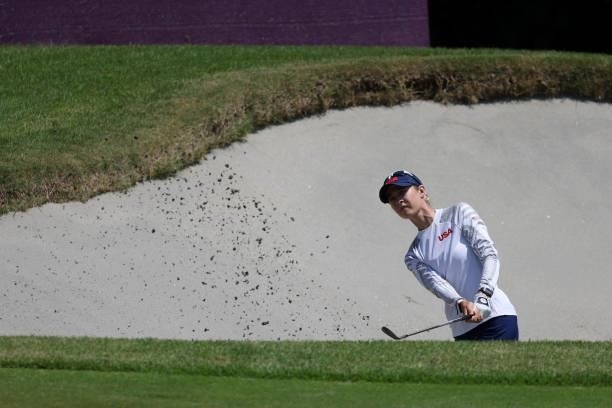 Nelly Korda of Team United States plays a shot from a bunker on the 14th hole during the third round of the Women's Individual Stroke Play on day...