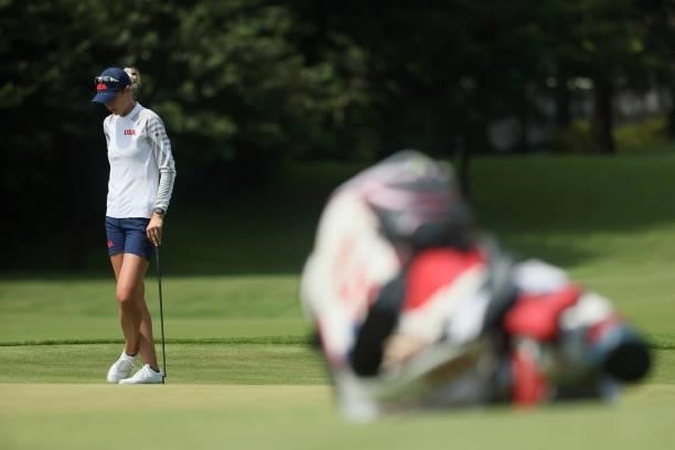 Nelly Korda of Team United States stands on the 17th green as her bag is seen during the third round of the Women's Individual Stroke Play on day...