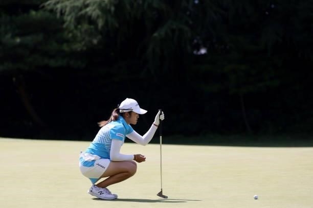 Mone Inami of Team Japan lines up her putt on the 17th green during the third round of the Women's Individual Stroke Play on day fourteen of the...
