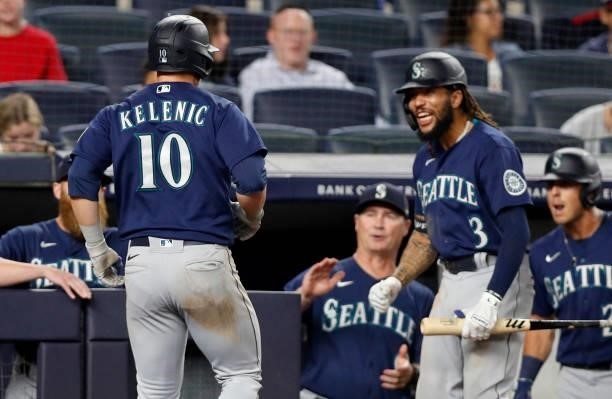 Jarred Kelenic of the Seattle Mariners celebrates his seventh inning home run against the New York Yankees with teammate J.P. Crawford at Yankee...