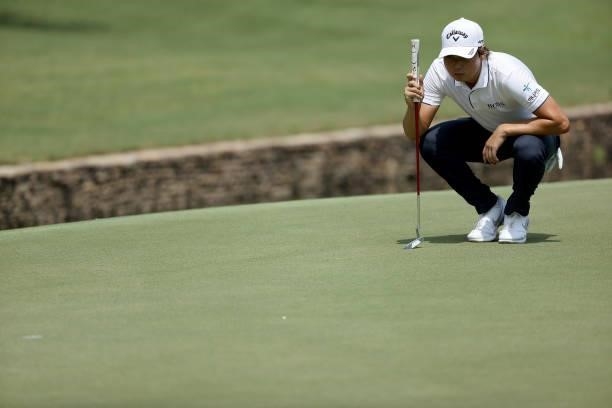 Min Woo Lee of Australia lines up a putt on the 15th green during the first round of the FedEx St. Jude Invitational at TPC Southwind on August 05,...