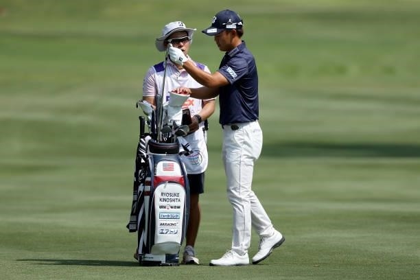 Ryosuke Kinoshita of Japan selects a club on the 15th hole during the first round of the FedEx St. Jude Invitational at TPC Southwind on August 05,...