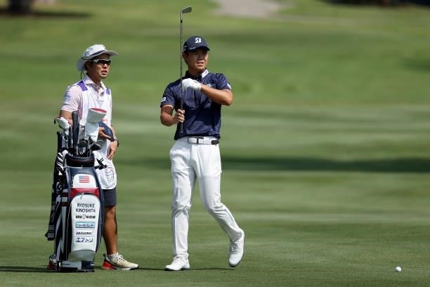 Ryosuke Kinoshita of Japan selects a club on the 15th hole during the first round of the FedEx St. Jude Invitational at TPC Southwind on August 05,...