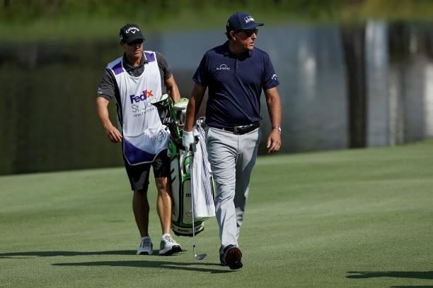 Phil Mickelson walks across the 12th hole during the first round of the FedEx St. Jude Invitational at TPC Southwind on August 05, 2021 in Memphis,...