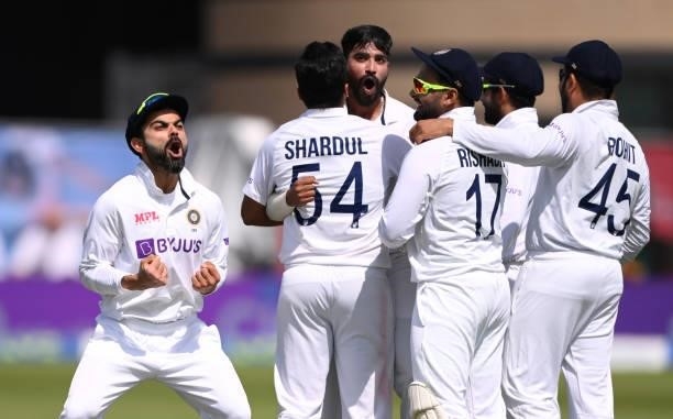 India Captain Virat Kohli celebrates after the review against Zak Crawley by bowler Mohammed Siraj is given out during day one of the First Test...