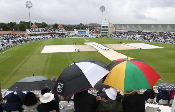 Covers are seen on the wicket as rain stops play during day three of the First LV= Insurance test match between England and India at Trent Bridge on...