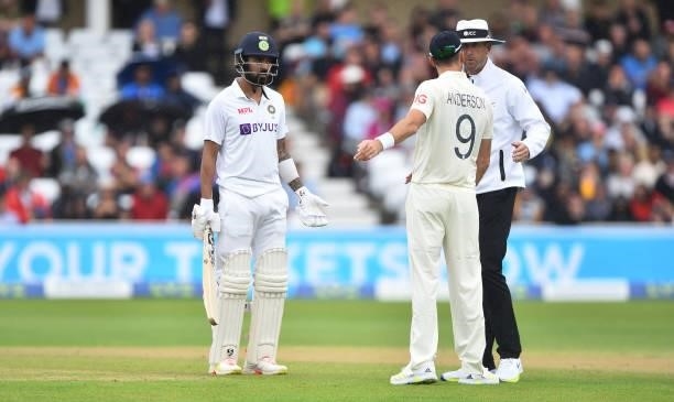 England bowler James Anderson has words with umpire Michael Gough as KL Rahul looks on as rain falls but play continues during day three of the First...
