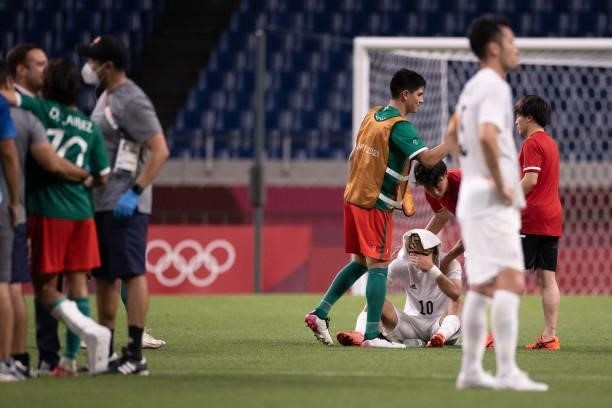 Ritsu Doan of Team Japan is consoled following defeat in the Men's Bronze Medal Match between Mexico and Japan on day fourteen of the Tokyo 2020...