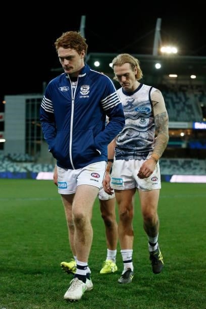 An injured Gary Rohan of the Cats walks from the ground after the round 21 AFL match between Geelong Cats and Greater Western Sydney Giants at GMHBA...