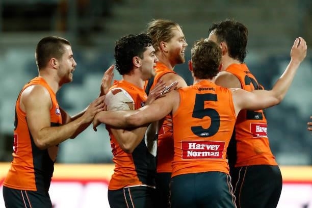 Harry Himmelberg of the Giants celebrates a goal during the round 21 AFL match between Geelong Cats and Greater Western Sydney Giants at GMHBA...