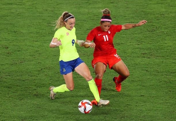 Kosovare Asllani of Team Sweden is challenged by Desiree Scott of Team Canada during the Women's Gold Medal Match between Canada and Sweden on day...