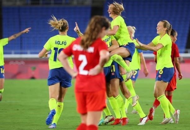 Players of Team Sweden celebrate a goal by Stina Blackstenius of Team Sweden to take a 1-0 lead during the women's football gold medal match between...