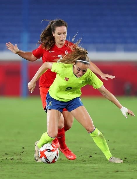 Kosovare Asllani of Team Sweden battles for possession with Allysha Chapman of Team Canada during the Women's Gold Medal Match between Canada and...