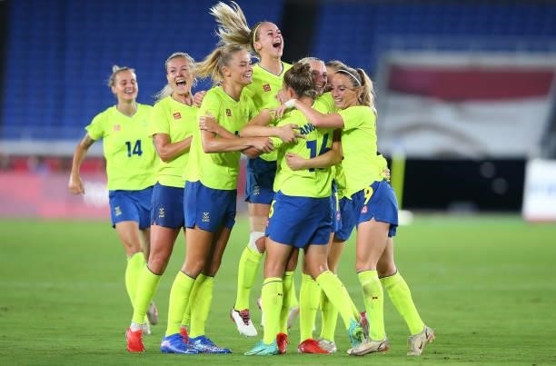 Stina Blackstenius of Team Sweden celebrates with Filippa Angeldal, Kosovare Asllani and teammates after scoring their team's first goal during the...
