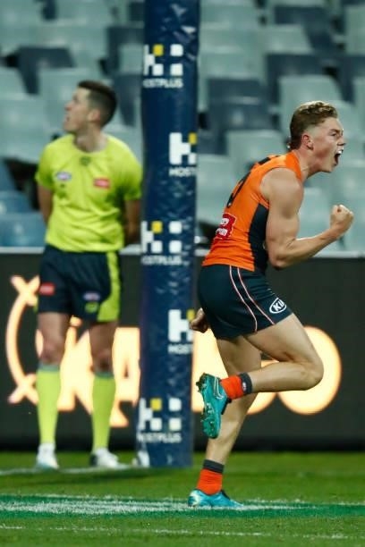 Tanner Bruhn of the Giants celebrates a goal during the round 21 AFL match between Geelong Cats and Greater Western Sydney Giants at GMHBA Stadium on...