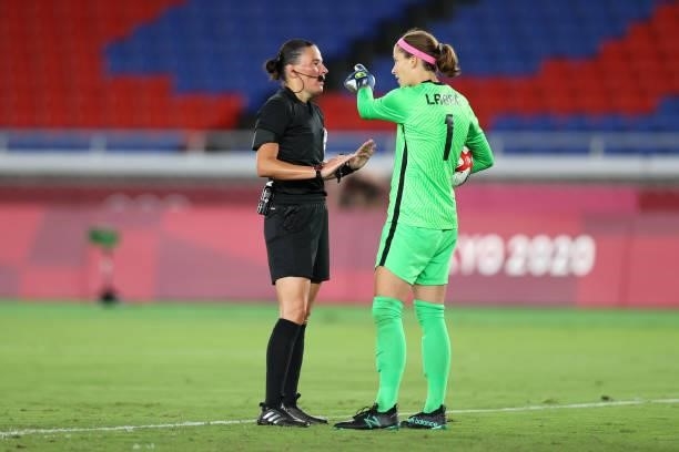 Match Referee, Anastasia Pustovoitova interacts with Stephanie Labbe of Team Canada during the Women's Gold Medal Match between Canada and Sweden on...