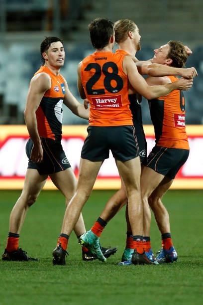 Harry Himmelberg of the Giants celebrates a goal during the round 21 AFL match between Geelong Cats and Greater Western Sydney Giants at GMHBA...