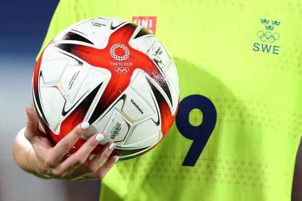 Kosovare Asllani of Team Sweden holds the Tokyo 2020 Olympic match ball during the Women's Gold Medal Match between Canada and Sweden on day fourteen...