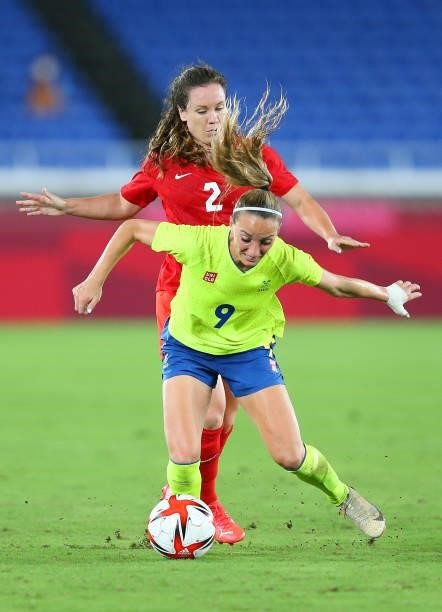 Kosovare Asllani of Team Sweden is tackled by Allysha Chapman of Team Canada during the Women's Gold Medal Match between Canada and Sweden on day...