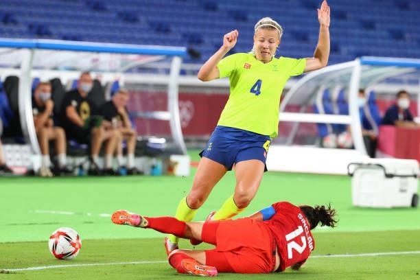 Hanna Glas of Team Sweden and Christine Sinclair of Team Canada collide for possession during the first half during the women's football gold medal...