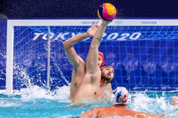 Branislav Mitrovic of Team Serbia, Roger Tahull of Team Spain during the Tokyo 2020 Olympic Waterpolo Tournament men's Semi Final match between...