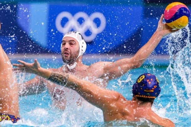 Filip Filipovic of Serbia, Roger Tahull of Team Spain during the Tokyo 2020 Olympic Waterpolo Tournament men's Semi Final match between Serbia and...