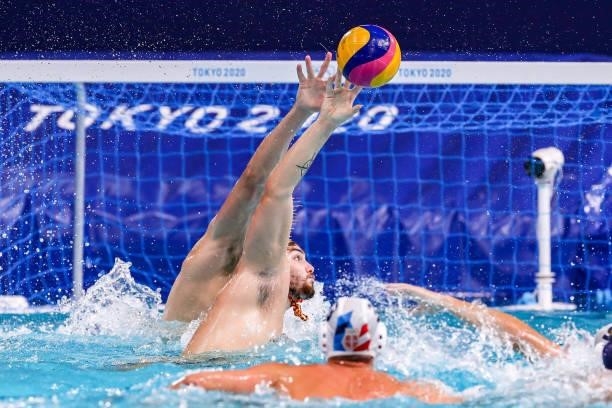 Branislav Mitrovic of Serbia, Roger Tahull of Team Spain during the Tokyo 2020 Olympic Waterpolo Tournament men's Semi Final match between Serbia and...