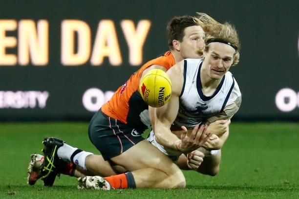 Toby Greene of the Giants tackles Tom Stewart of the Cats during the round 21 AFL match between Geelong Cats and Greater Western Sydney Giants at...