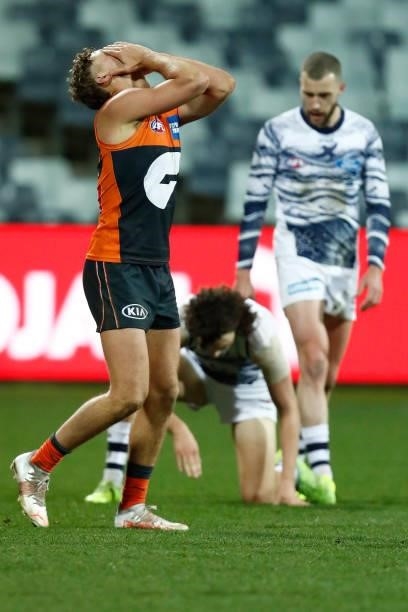 Harry Perryman of the Giants reacts after missing a goal during the round 21 AFL match between Geelong Cats and Greater Western Sydney Giants at...