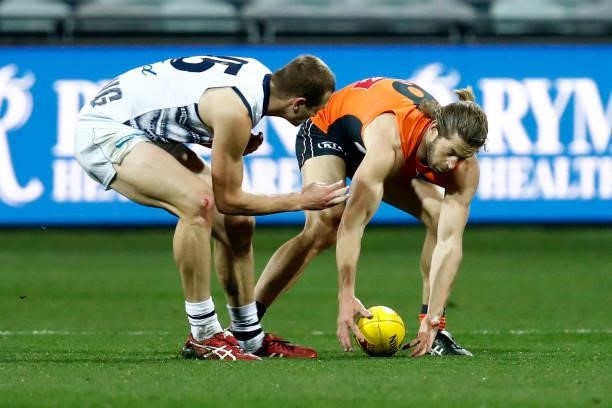 Nathan Kreuger of the Cats and Callan Ward of the Giants collide during the round 21 AFL match between Geelong Cats and Greater Western Sydney Giants...