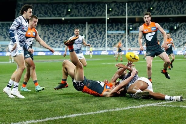 Esava Ratugolea of the Cats tackles Jake Stein of the Giants during the round 21 AFL match between Geelong Cats and Greater Western Sydney Giants at...