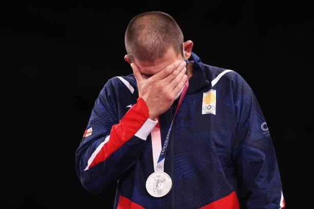 Silver medalist Geno Petriashvili of Team Georgia reacts as he poses with the silver medal during the Men's Freestyle 125kg medal ceremony on day...