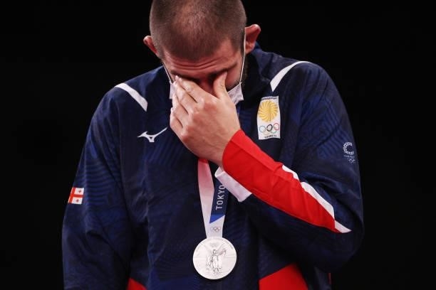 Silver medalist Geno Petriashvili of Team Georgia reacts as he poses with the silver medal during the Men's Freestyle 125kg medal ceremony on day...