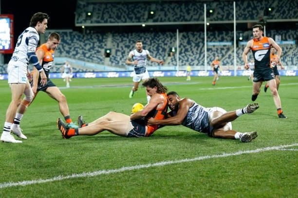 Esava Ratugolea of the Cats tackles Jake Stein of the Giants during the round 21 AFL match between Geelong Cats and Greater Western Sydney Giants at...