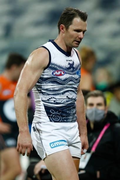 Patrick Dangerfield of the Cats walks to the bench after a heavy hit from Toby Greene of the Giants during the round 21 AFL match between Geelong...