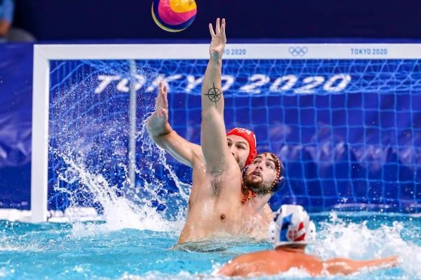Branislav Mitrovic of Serbia, Roger Tahull of Spain during the Tokyo 2020 Olympic Waterpolo Tournament men's Semi Final match between Serbia and...