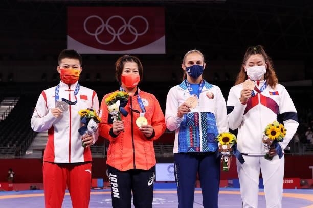 Silver medalist Qianyu Pang of Team China, gold medalist Mayu Mukaida of Team Japan and bronze medalists Vanesa Kaladzinskaya of Team Belarus and...