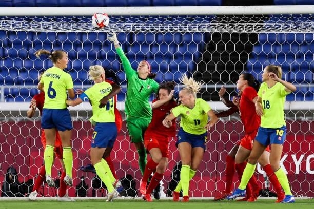 Stephanie Labbe of Canada competes for the ball during the Olympic women's football gold medal match between Sweden and Canada at International...