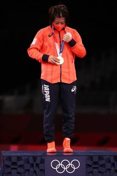 Gold medalist Mayu Mukaida of Team Japan poses with the gold medal during the Women's Freestyle 53kg medal ceremony on day fourteen of the Tokyo 2020...