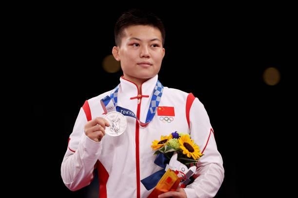 Silver medalist Qianyu Pang of Team China poses with the silver medal during the Women's Freestyle 53kg medal ceremony on day fourteen of the Tokyo...