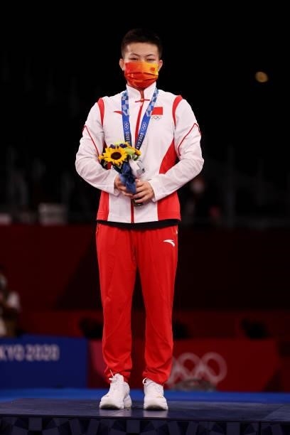 Silver medalist Qianyu Pang of Team China poses with the silver medal during the Women's Freestyle 53kg medal ceremony on day fourteen of the Tokyo...