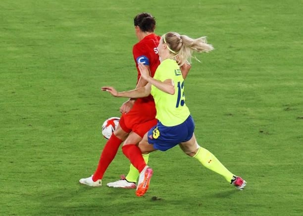 Christine Sinclair of Team Canada is fouled by Amanda Ilestedt of Team Sweden leading to a penalty being awarded during the Women's Gold Medal Match...